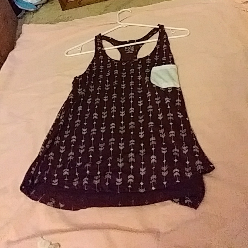 A purple razor back tank with arrows